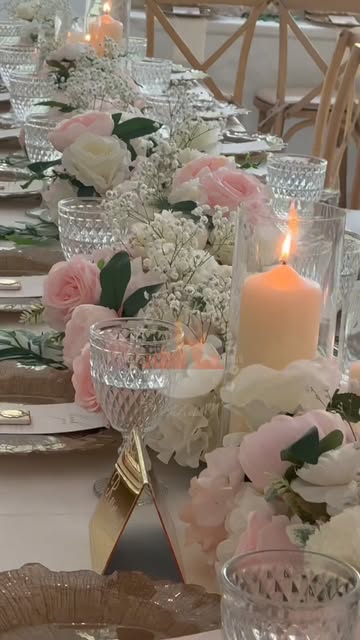 Blush tablescape with roses, candles and crystal
